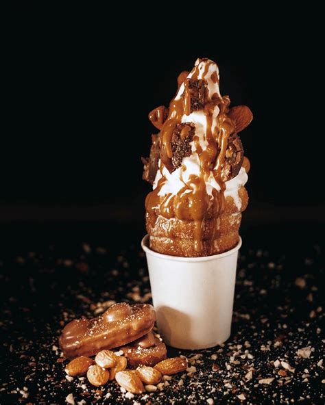 Crispy cones - A Crispy Cone is a fresh dough cone grilled rotisserie-style and covered in cinnamon and sugar. It can be filled with hazelnut chocolate, cookie butter or gourmet soft-serve ice cream.